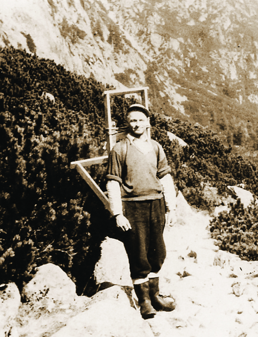 Historical sepia photograph of a Tatra mountain porter with a traditional wooden krošňa carrying frame
