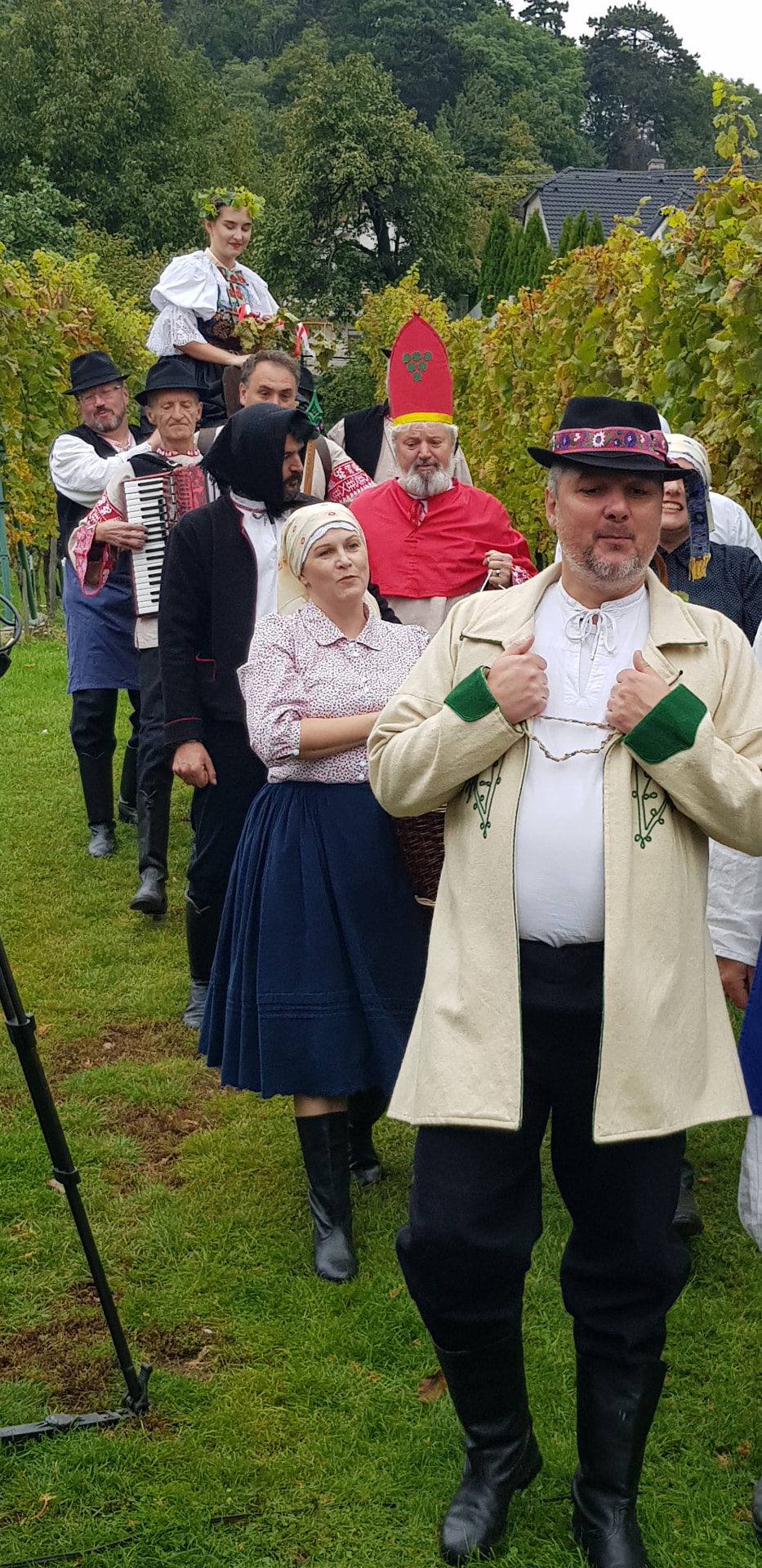 Community folklore gathering with musicians and people in traditional Slovak dress